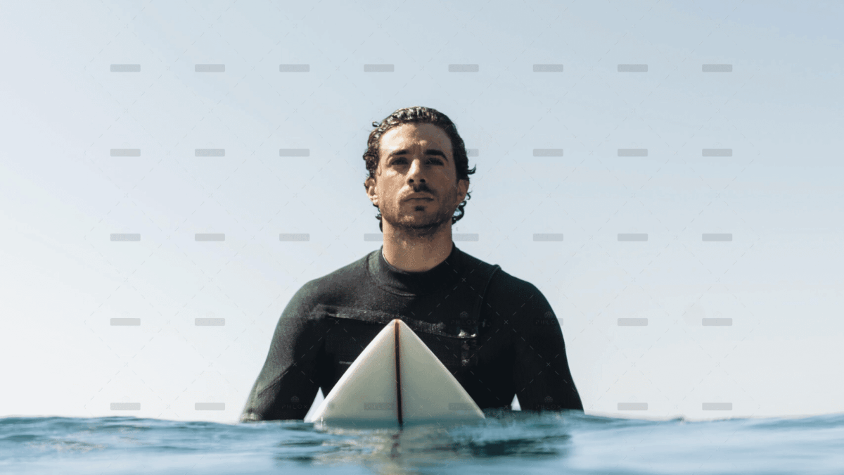 demo-attachment-684-medium-shot-man-sitting-surfboard-scaled