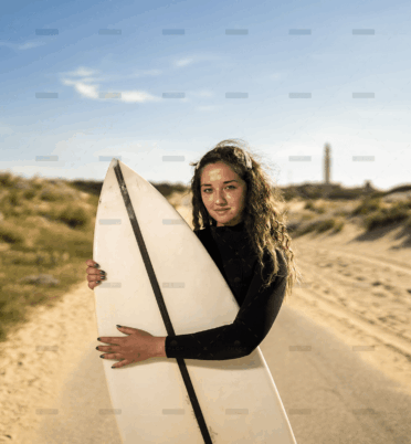 demo-attachment-316-shallow-focus-shot-attractive-female-hugging-surfboard-middle-road-spain